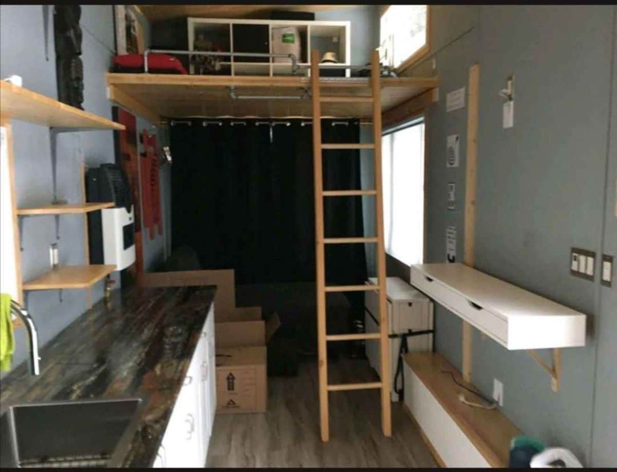 living area and loft leading to the loft of fully equipped tiny home