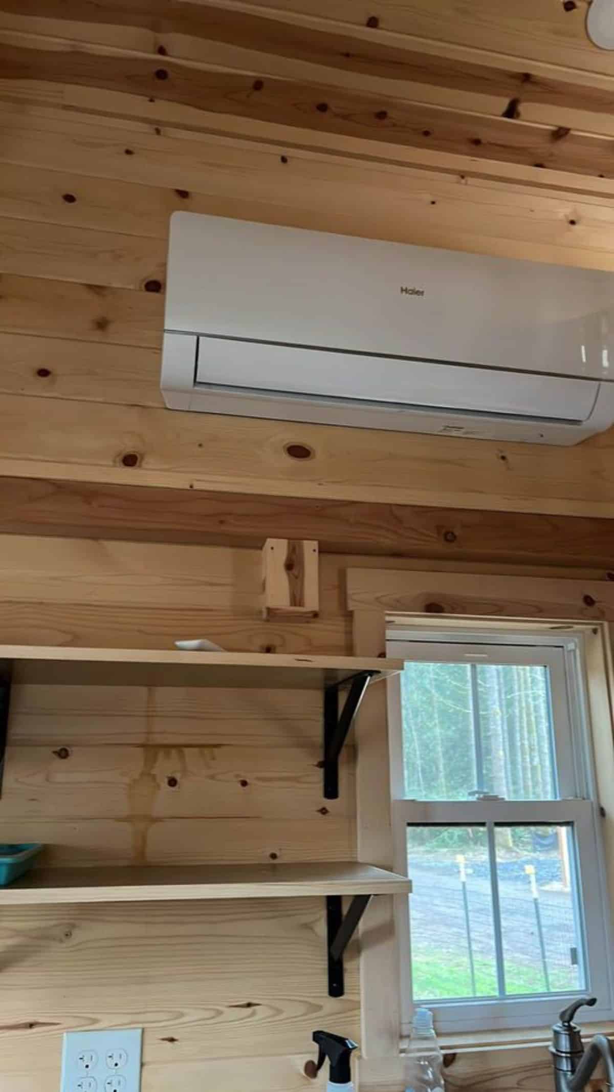 shelves and split A/c unit installed in the kitchen and