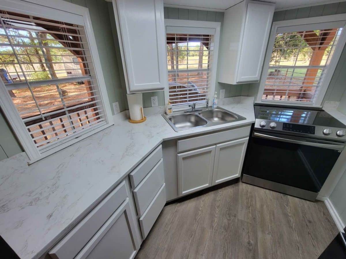 three sided kitchen area with huge countertop