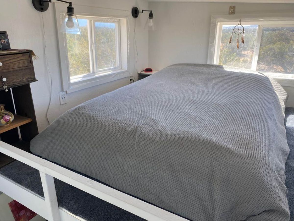 loft of 26' tiny house on wheels is huge with comfortable bed