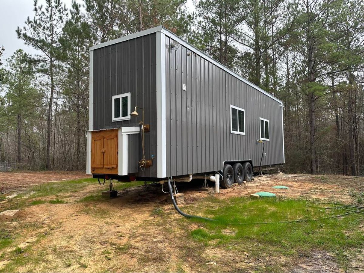 side view of 3 bedroom tiny house from outside