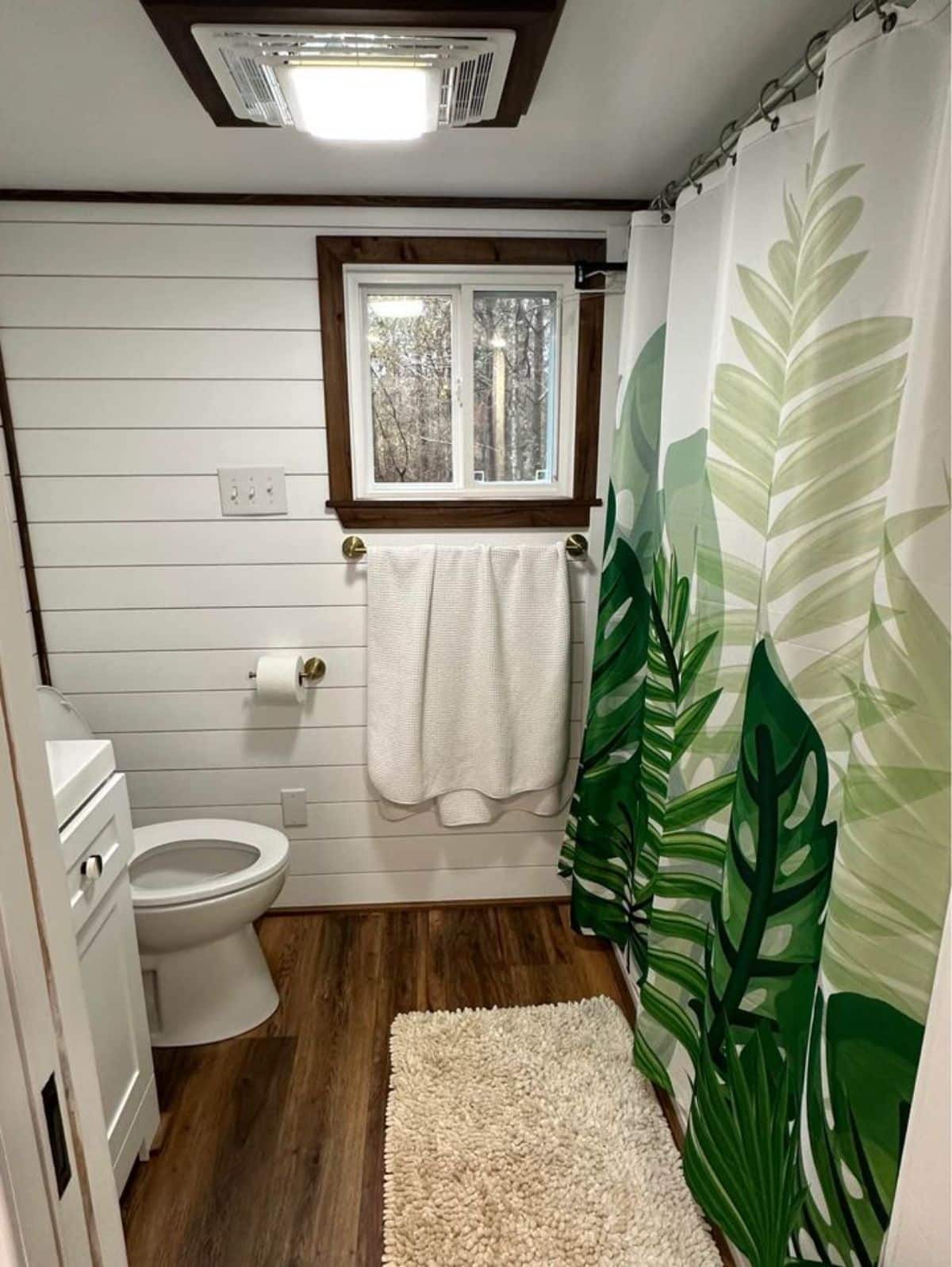 shower cum bath tub in bathroom of 3 bedroom tiny house