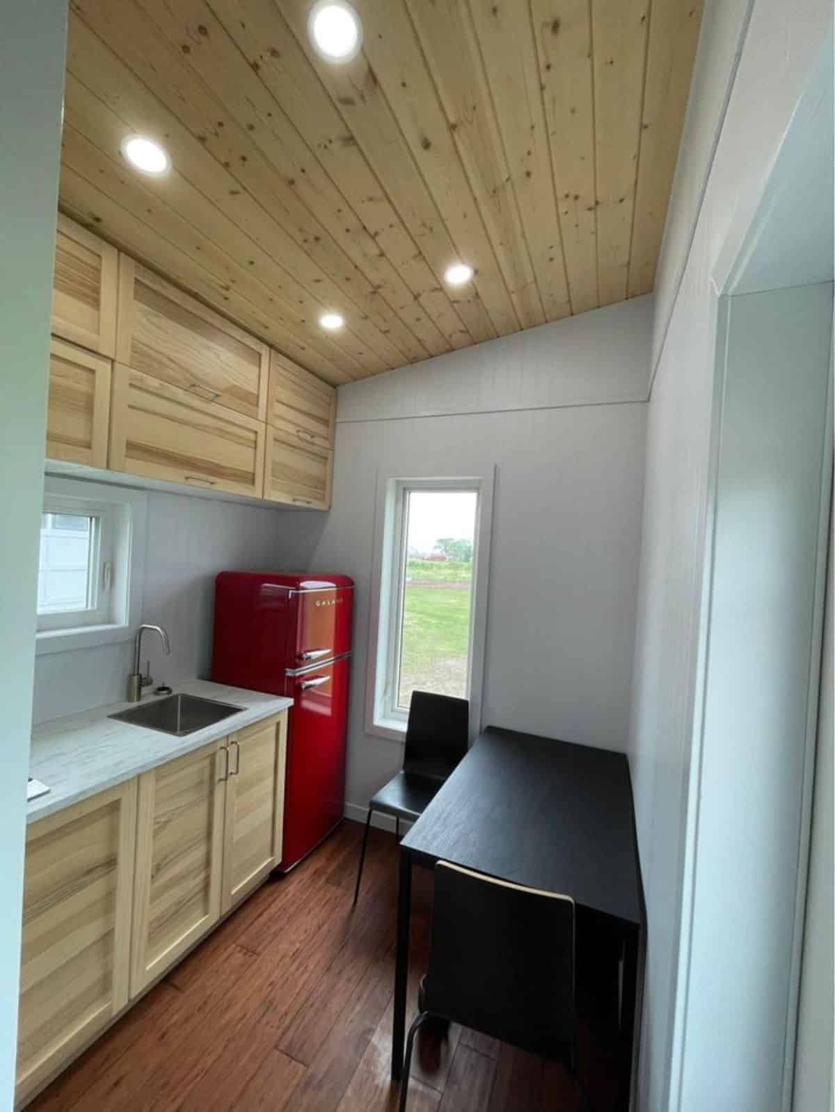 kitchen area with huge countertop and double door refrigerator
