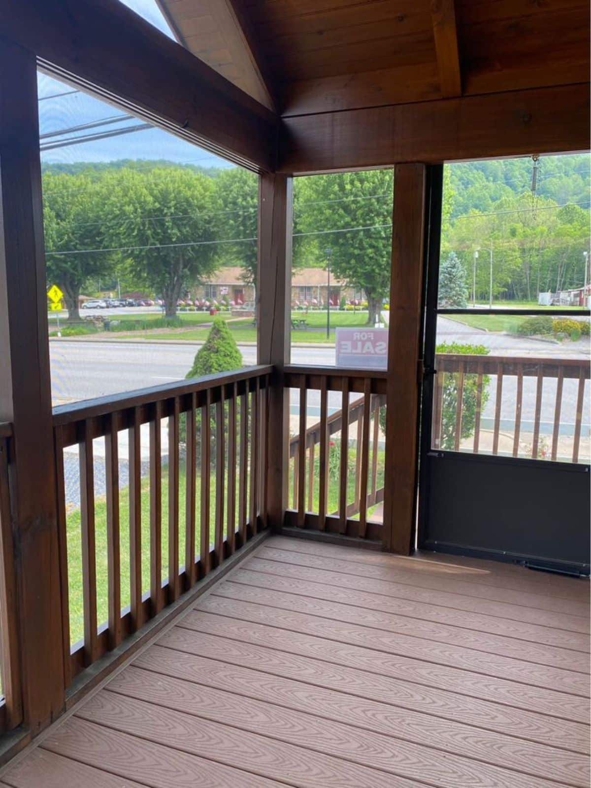 huge porch outside the main entrance door of custom built tiny home