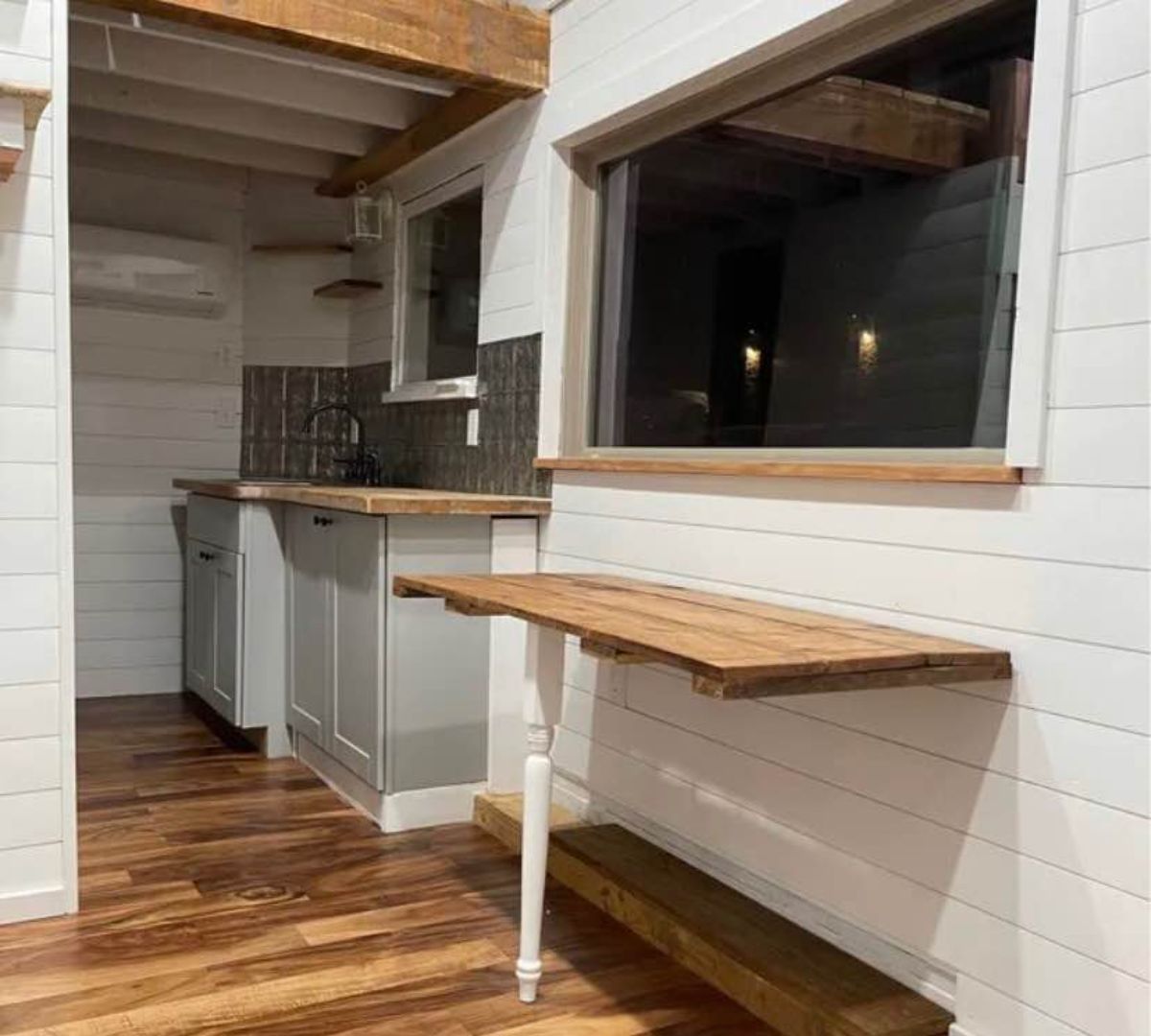 dining table in the living area of 1 bedroom tiny house