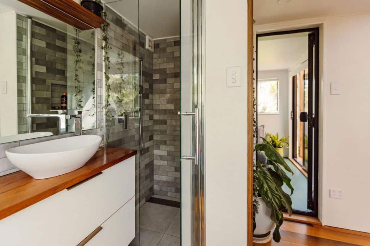 stunning bathroom has a space for washer dryer combo