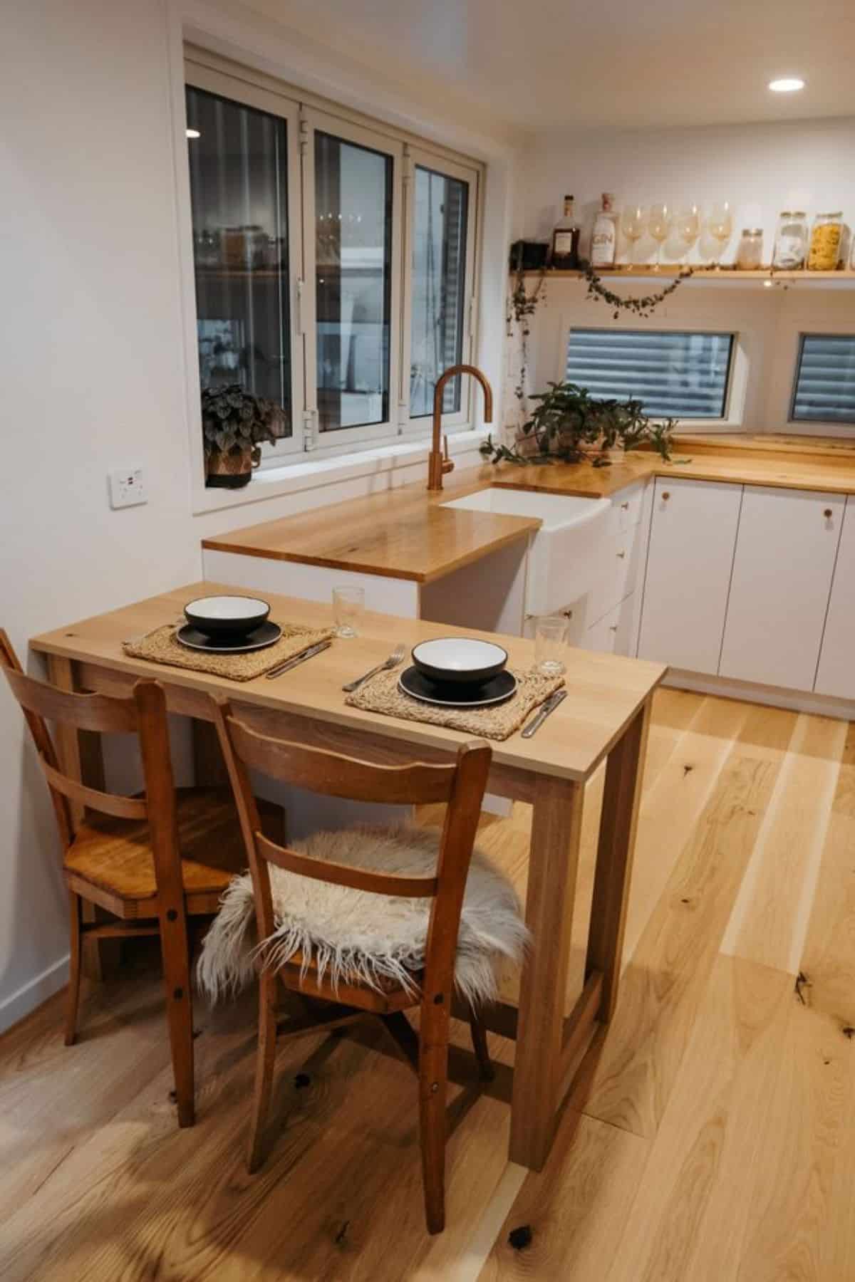 dining table with chairs besides the kitchen countertop