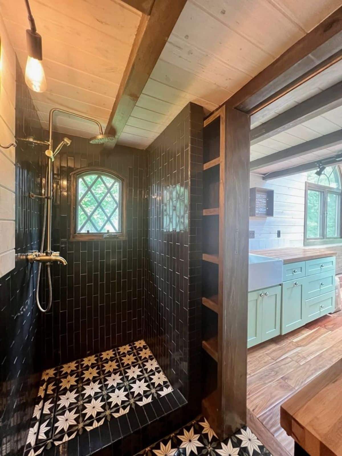 full length shower area in bathroom of 24' adorable tiny home