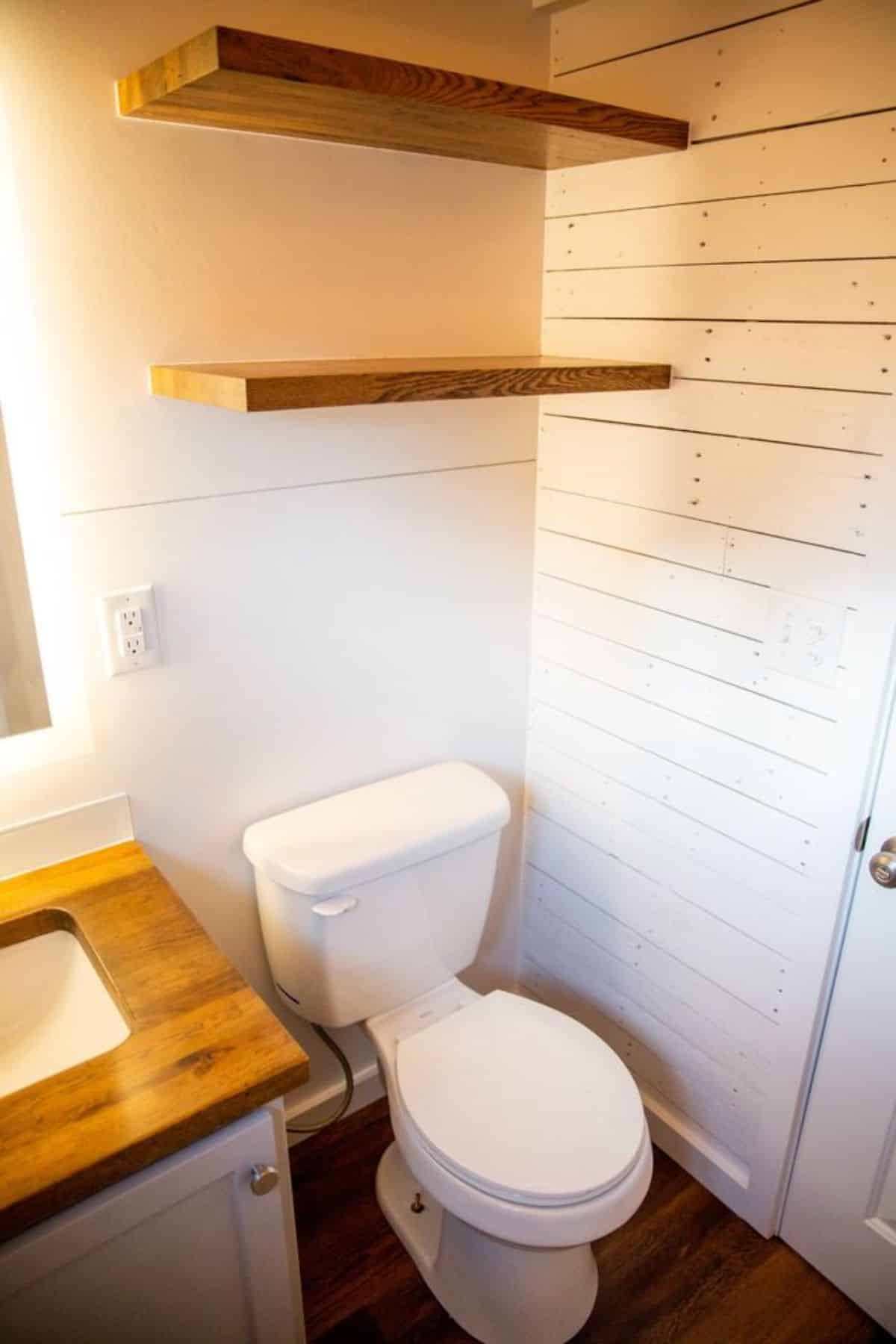bathroom of 24’ tiny house has all the standard fittings
