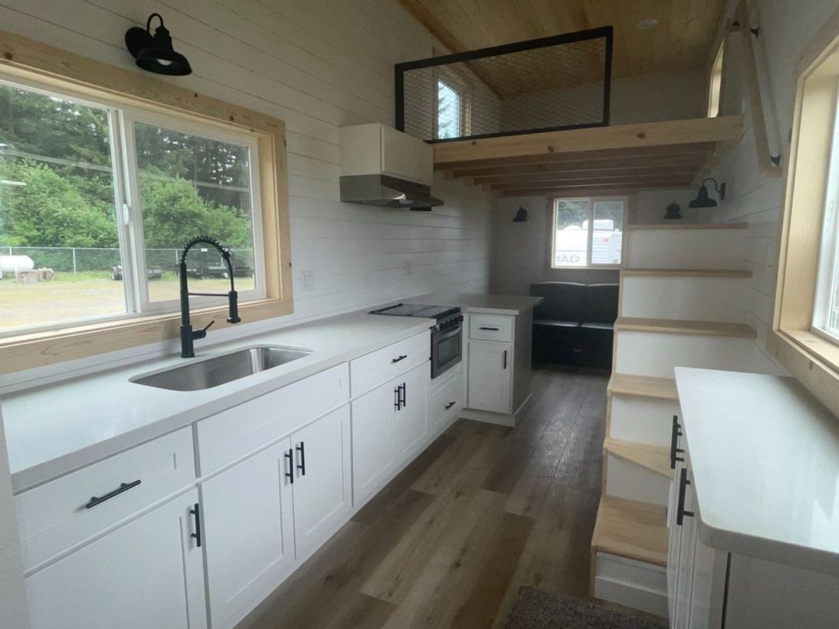 kitchen area is spacious and has multiple storage cabinets