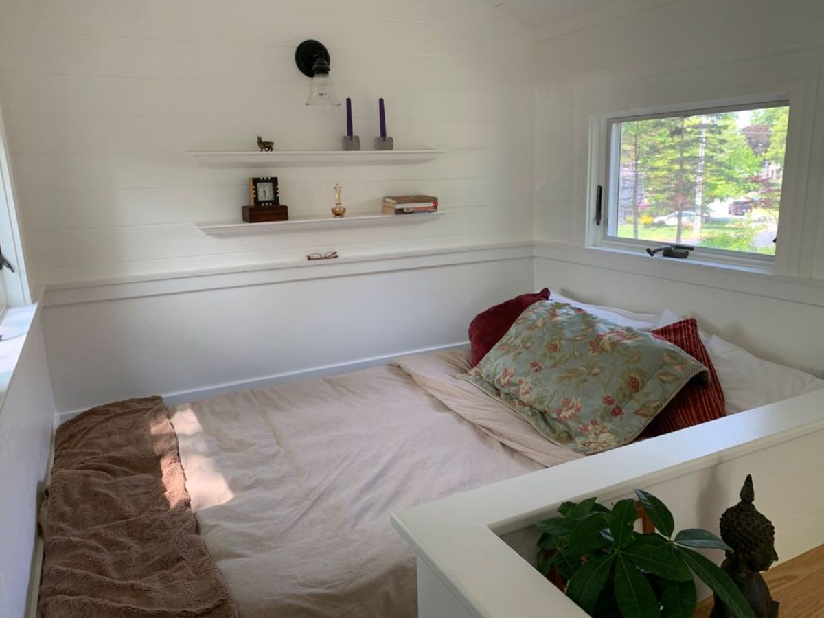 bedroom of Brand new tiny home is behind the living area