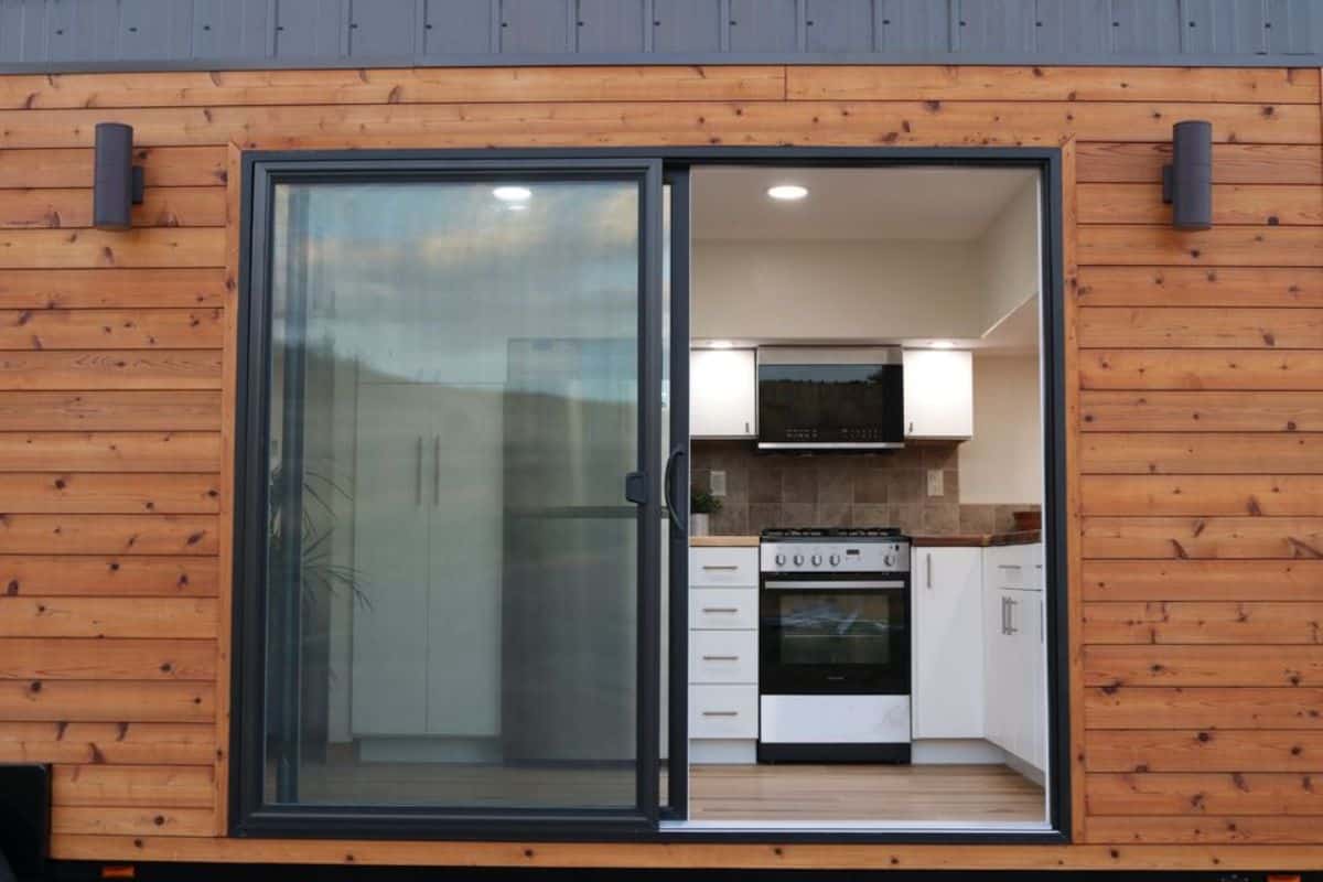 main glass door of two storey tiny house