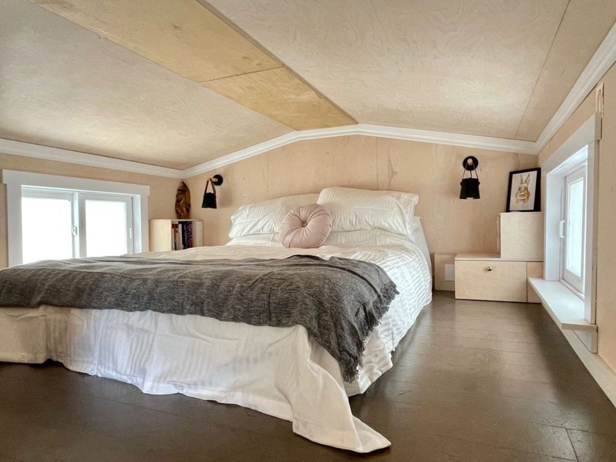 main loft bedroom has a double bed with side tables and ample space