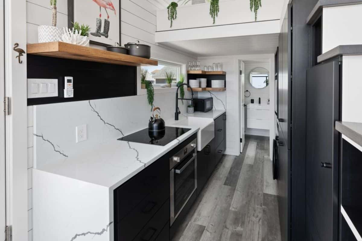 kitchen area is stunning with white and black marble top