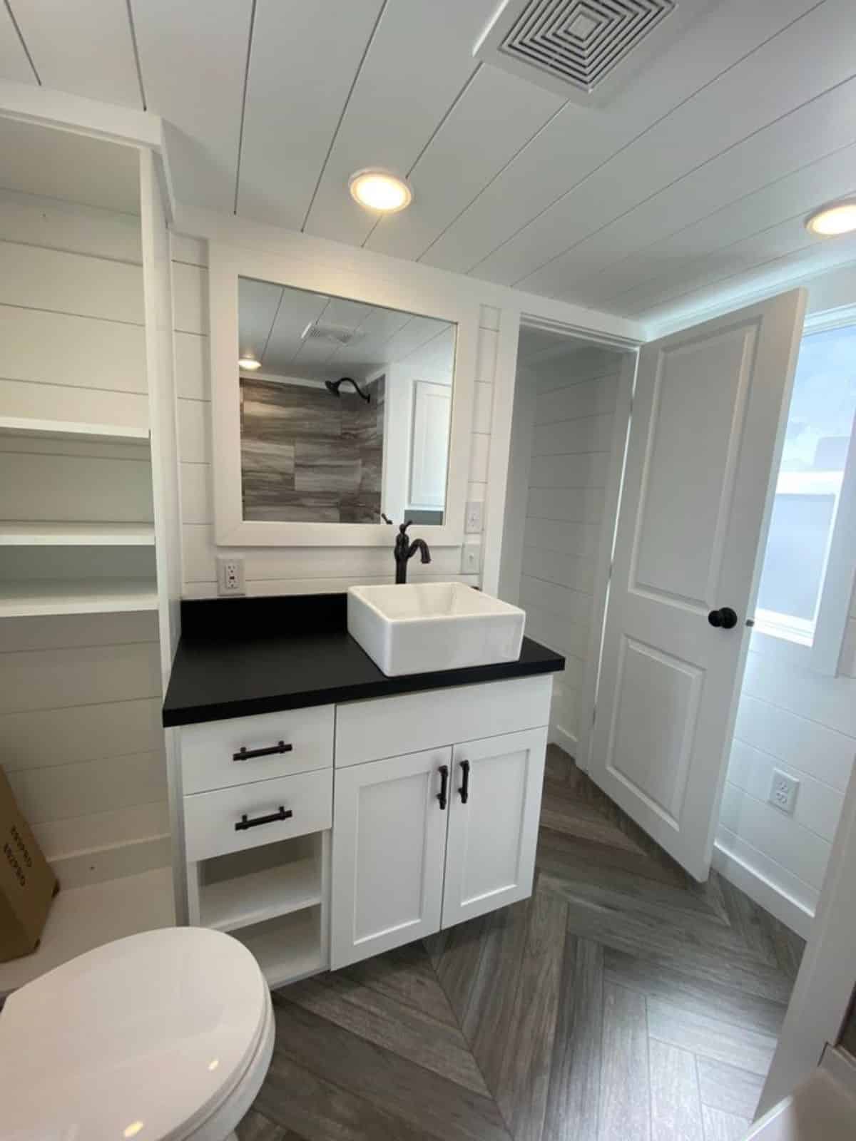 bathroom of Stunning 28’ tiny house has all the standard fittings