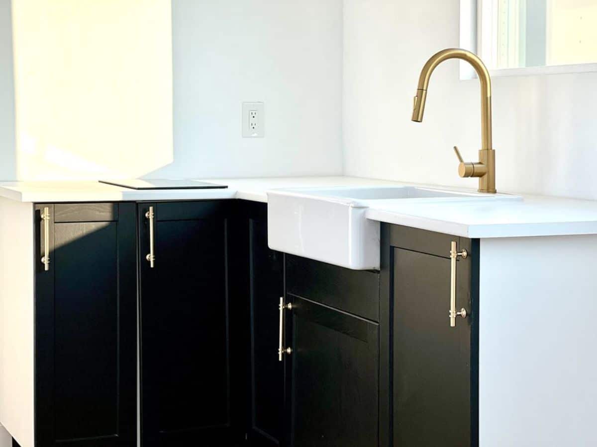 L shaped kitchen countertop with storage cabinets