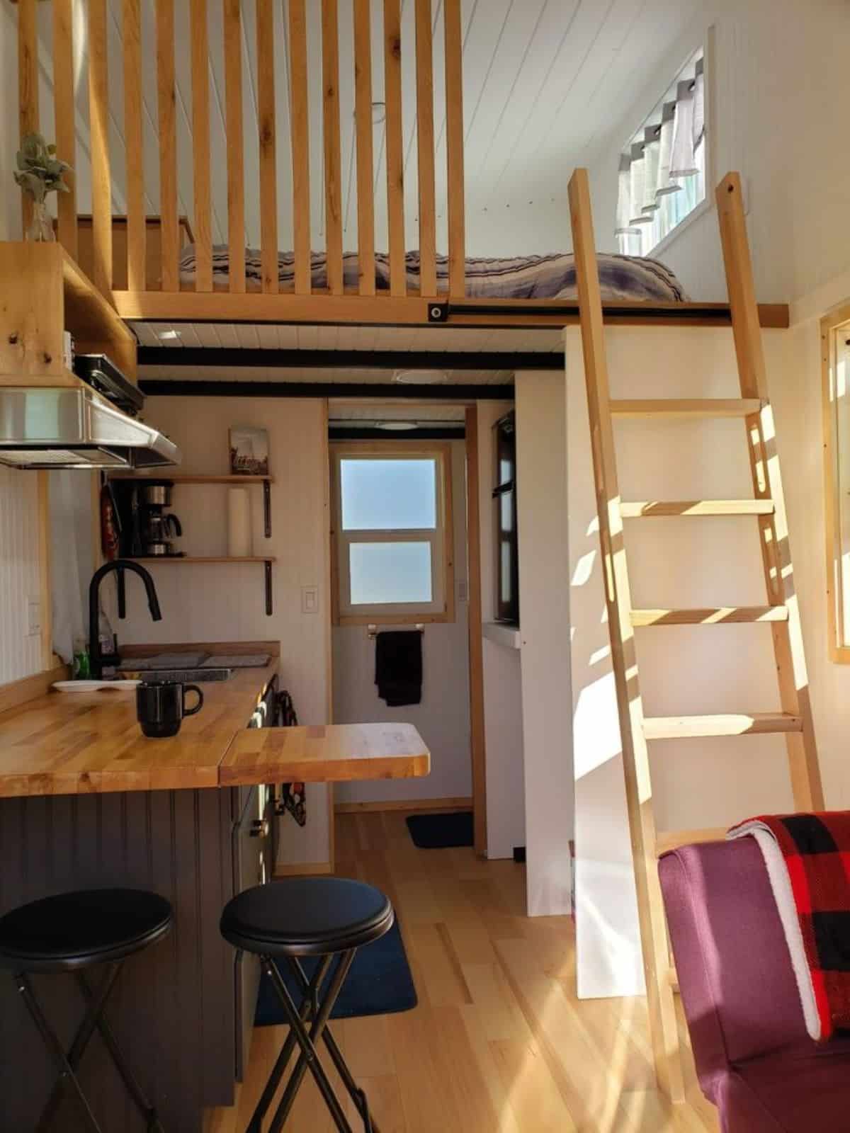 full length wooden interiors of tiny home for one
