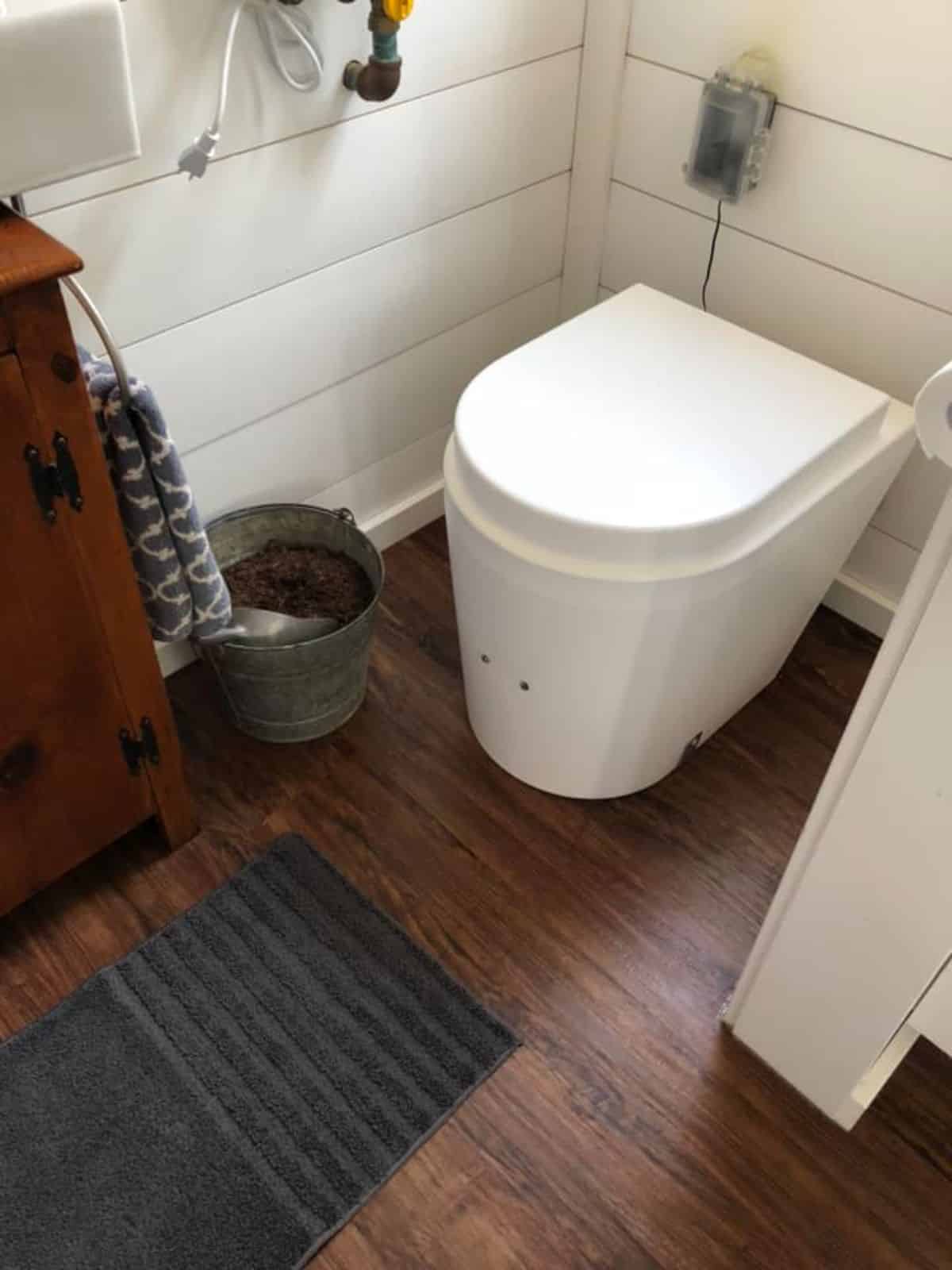 composting toilet in bathroom of 20' fully furnished tiny home