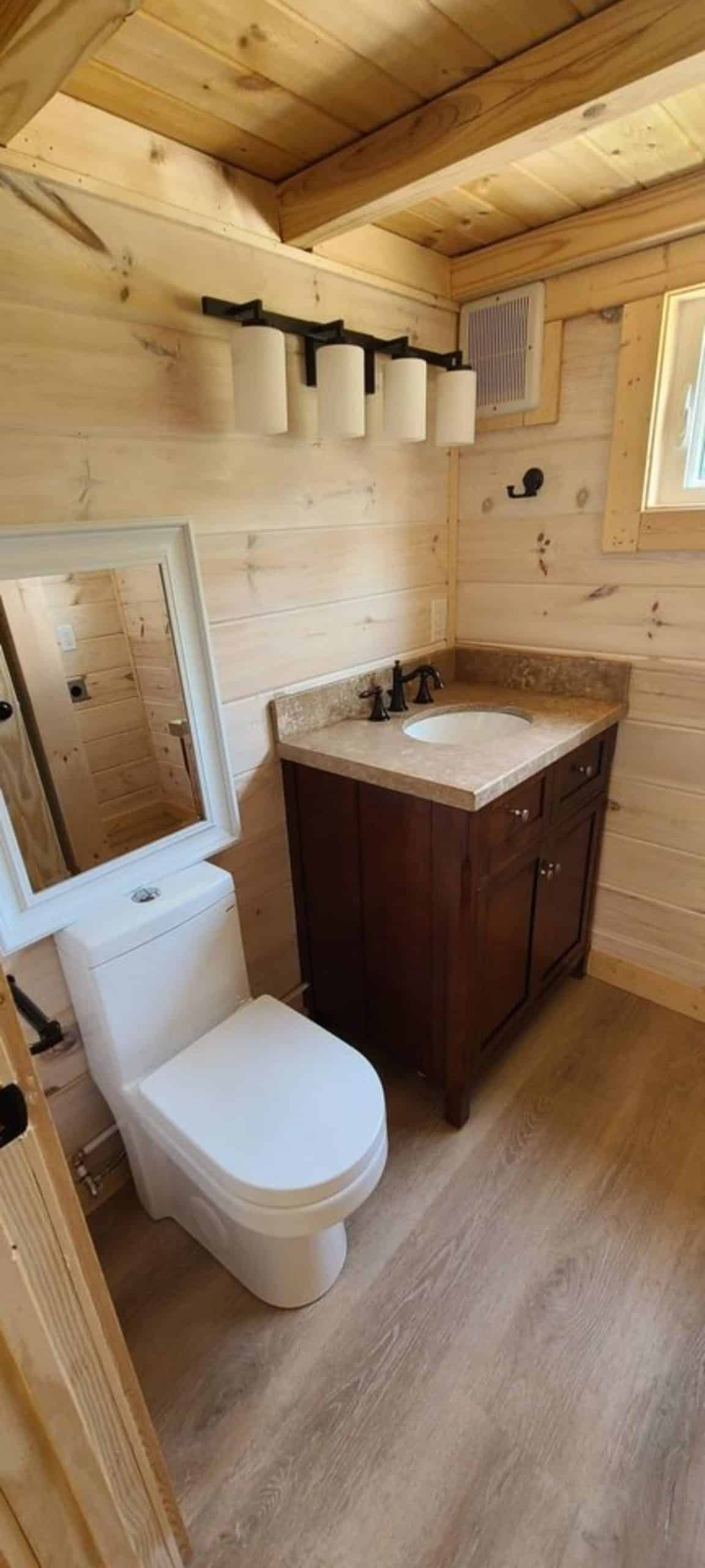standard fittings in bathroom of 20' lofted tiny home