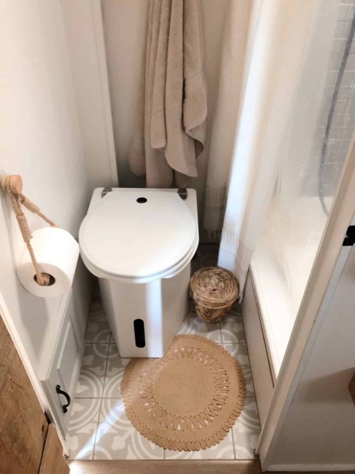 composting toilet instead of regular toilet installed in bathroom