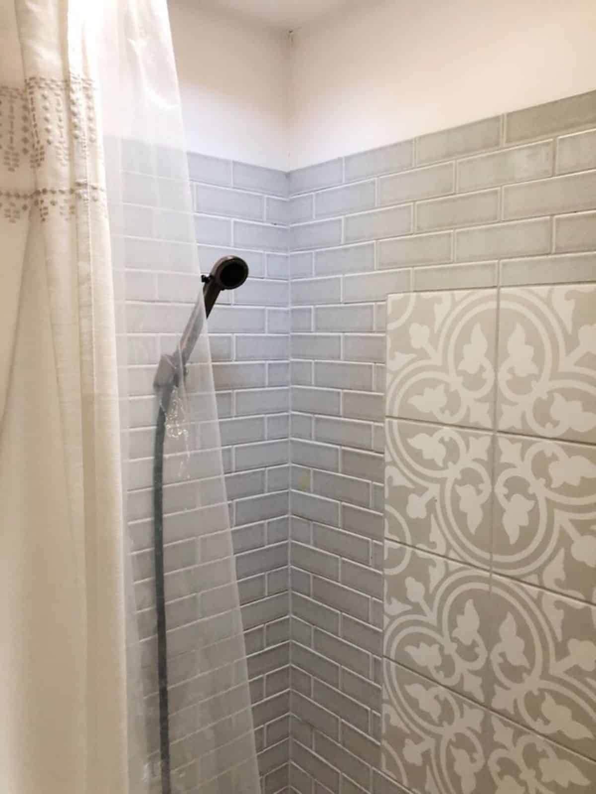 full length shower area in bathroom of tiny camper home