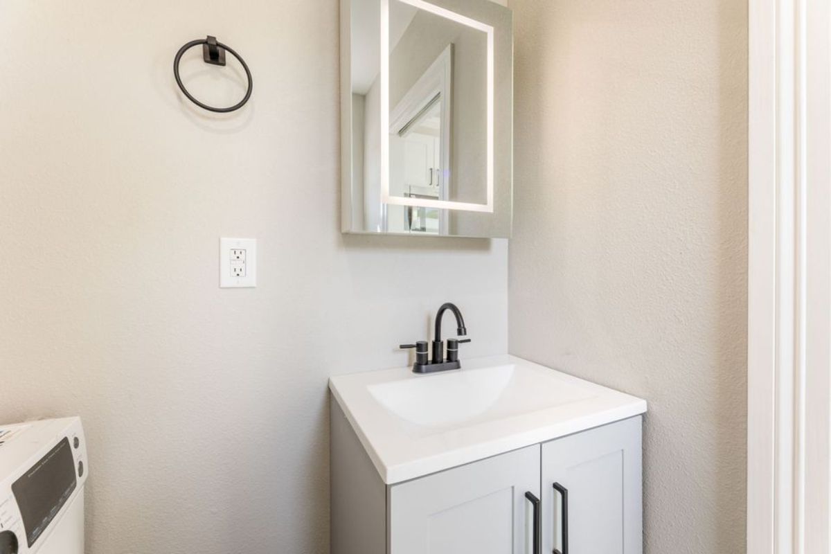 sink with vanity and mirror