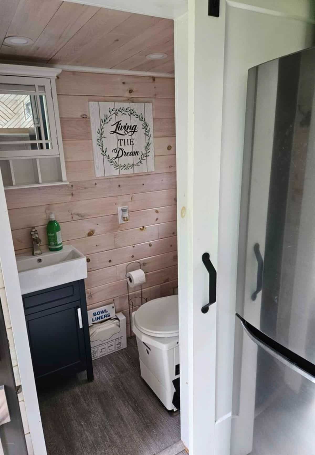 standard toilet installed in bathroom
