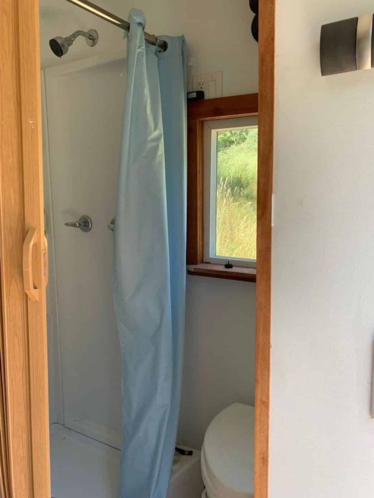 bathroom of 22' Modern Tiny House has all the standard fittings