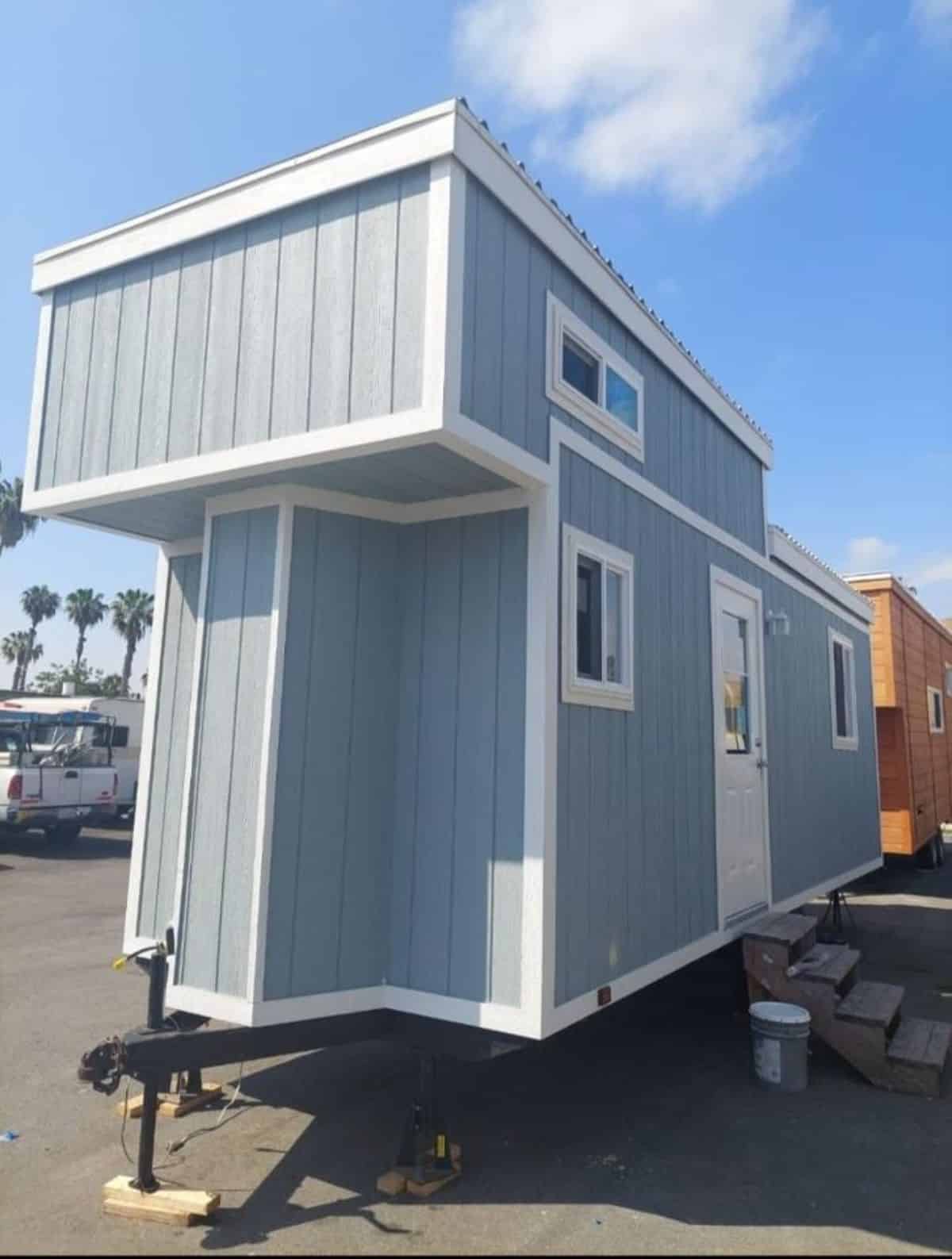 side exterior view of cottage tiny home