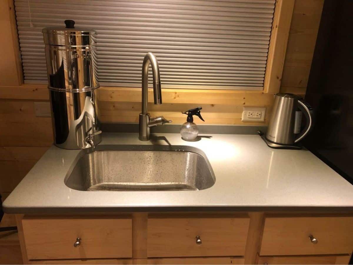 sink with storage in kitchen area
