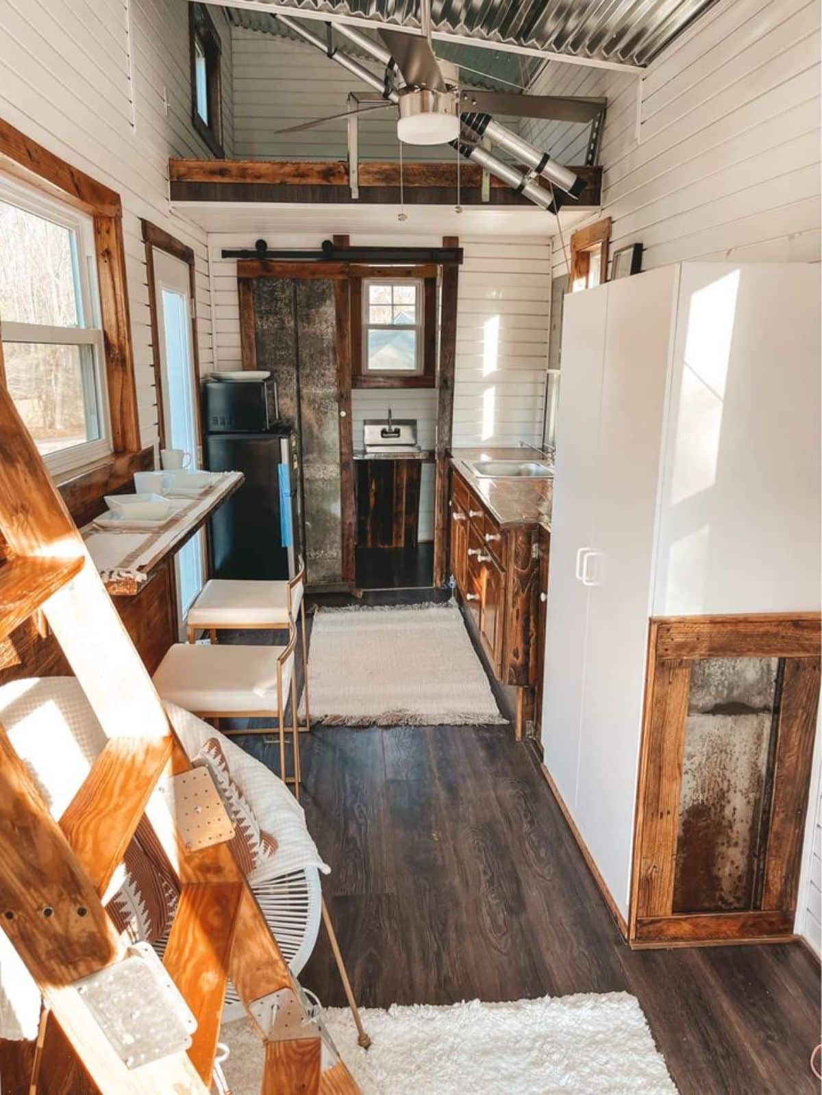 full length wooden interiors of gorgeous tiny home