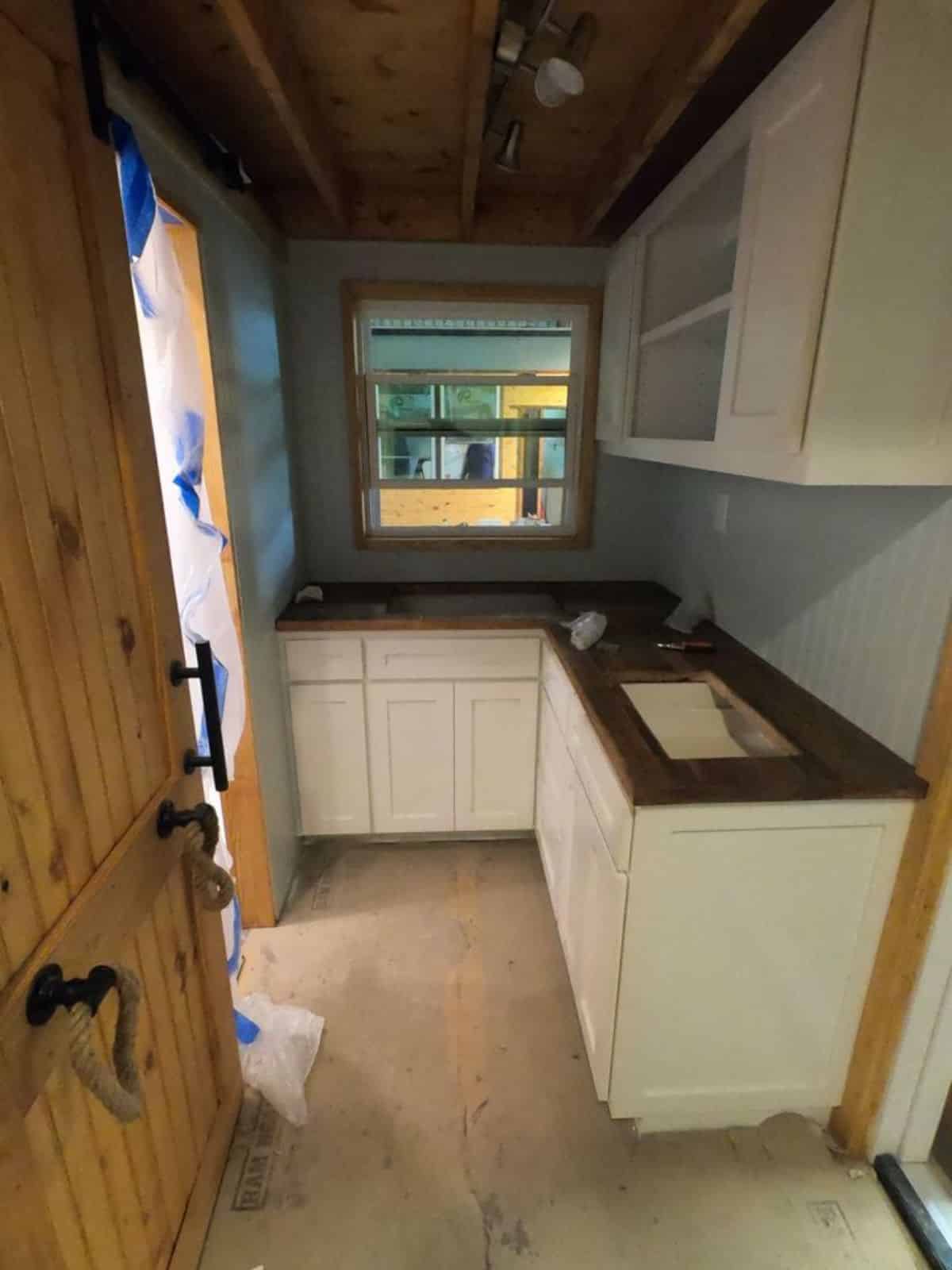 L shaped kitchen area of durable tiny home