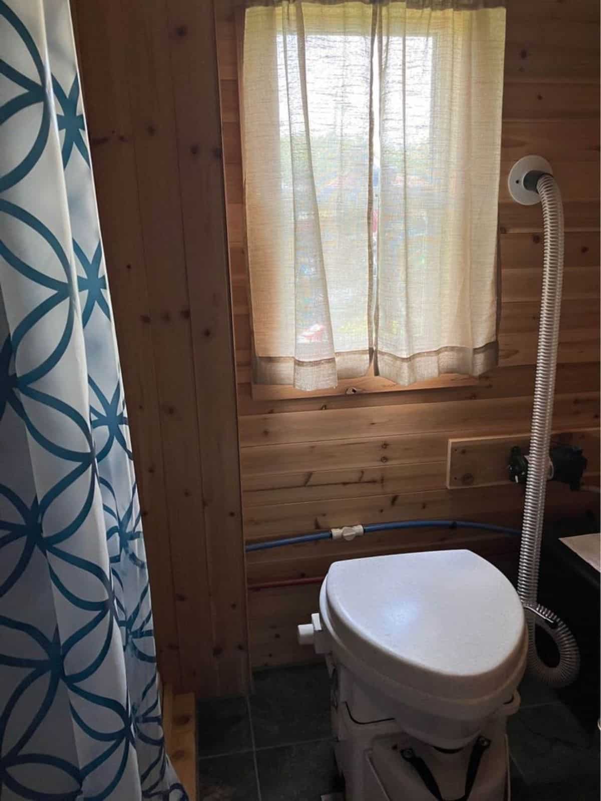 composting toilet in bathroom of one bedroom tiny home