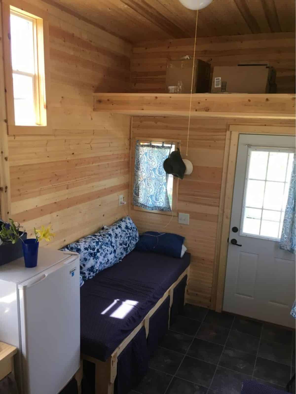 full length wooden interiors of one bedroom tiny home