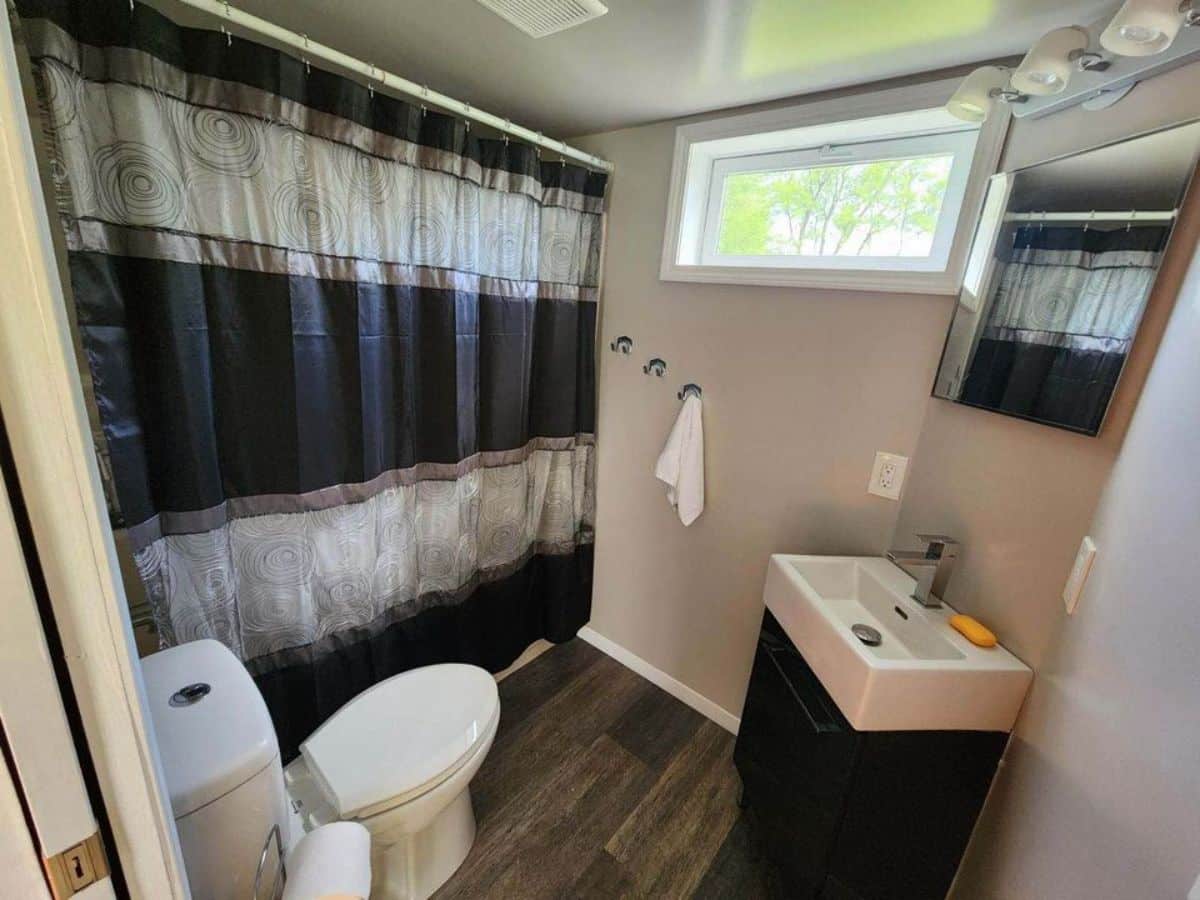 bathroom of semi furnished tiny house has all the standard fittings
