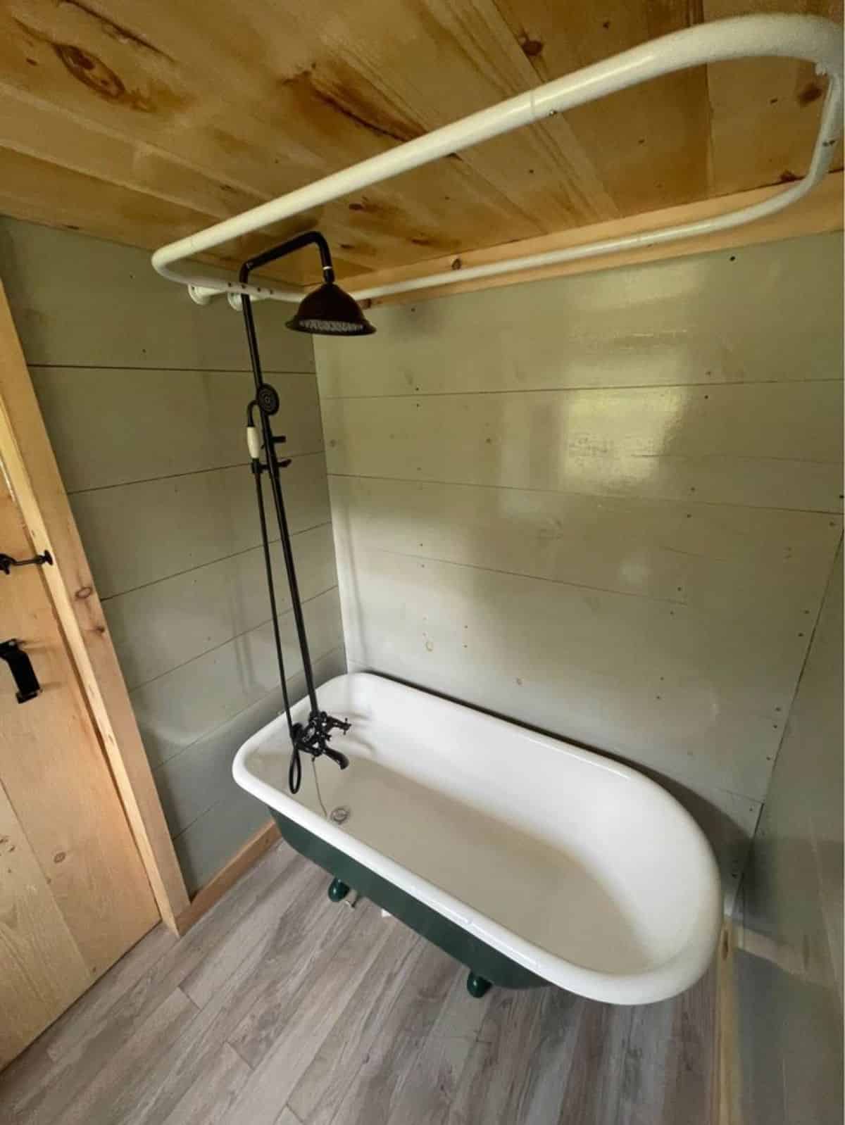 bathroom has a stunning bathtub cum shower