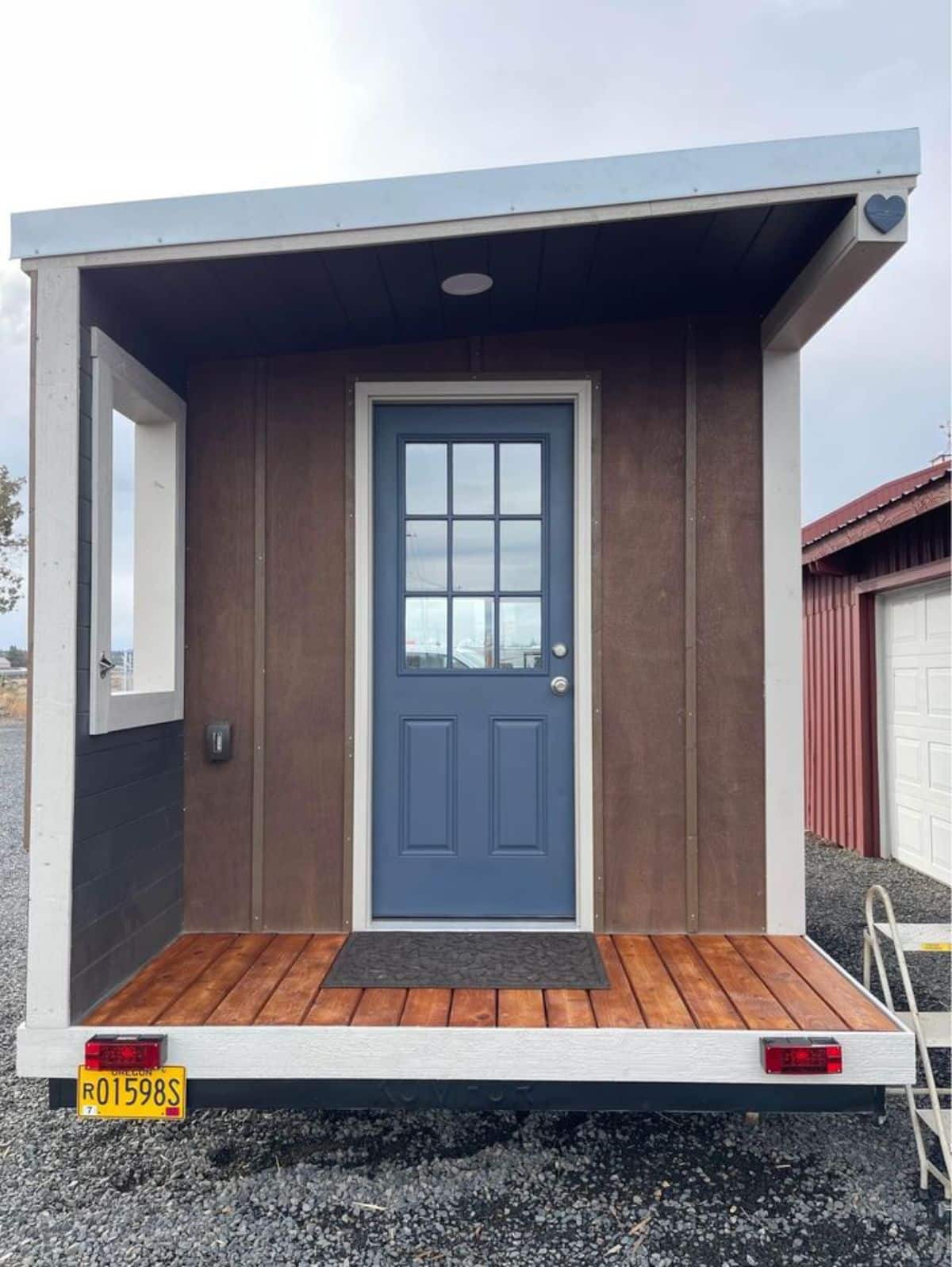 small porch outside the main entrance door of 17' furnished tiny house