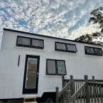 Featured Img of Two Lofts and Towable Setup Make This Tiny House on Wheels a Steal Deal!