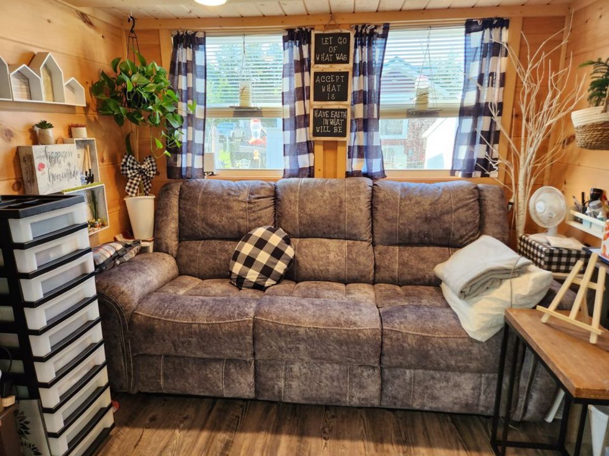 comfortable three seater couch with storage cabinets