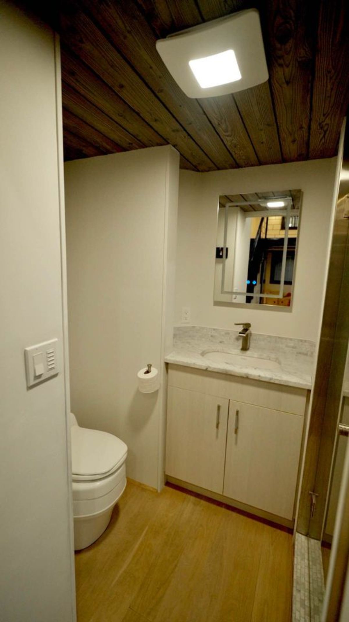 bathroom of premium tiny home has all the standard fittings 