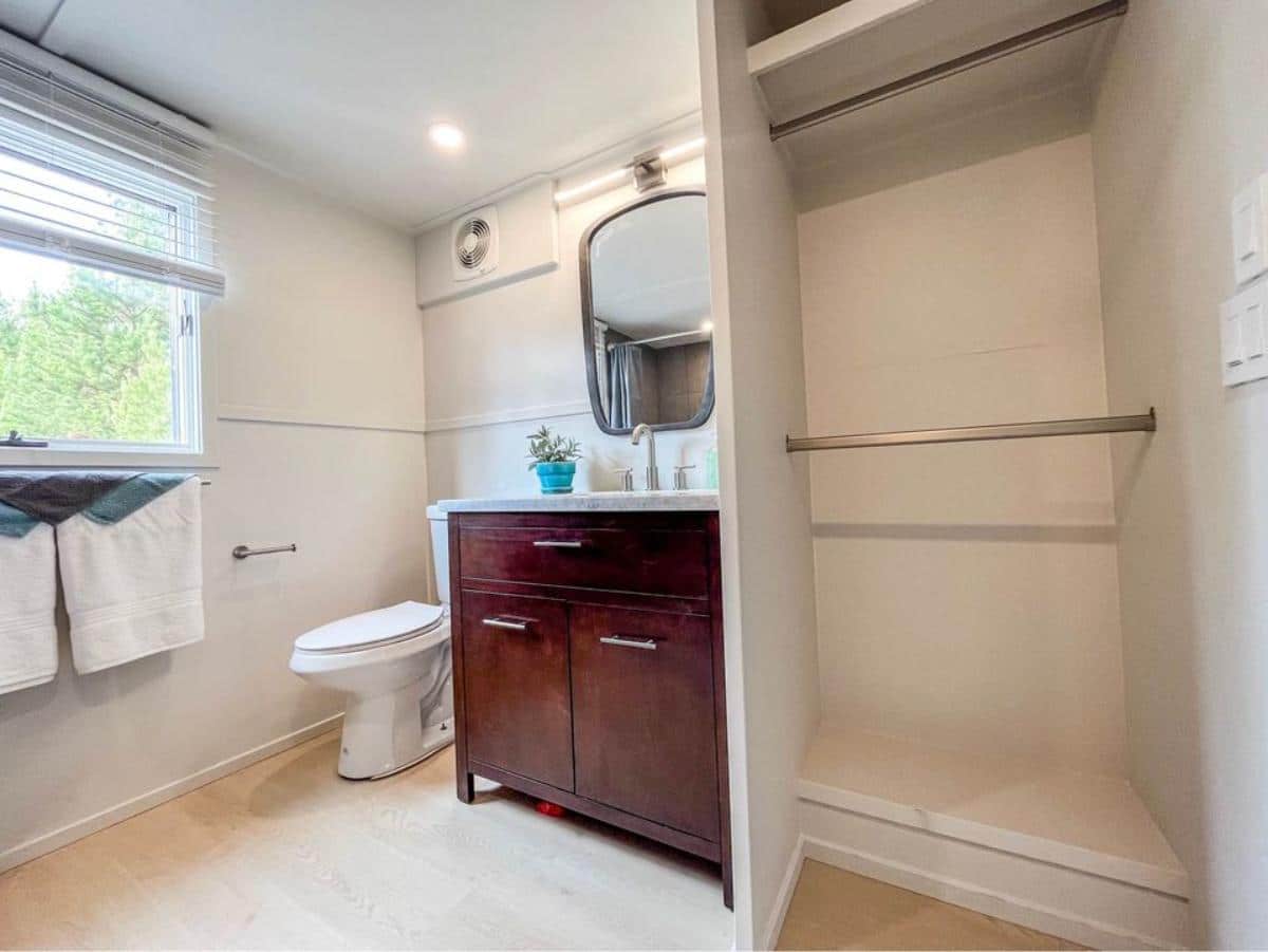 sink with vanity and standard toilet in bathroom