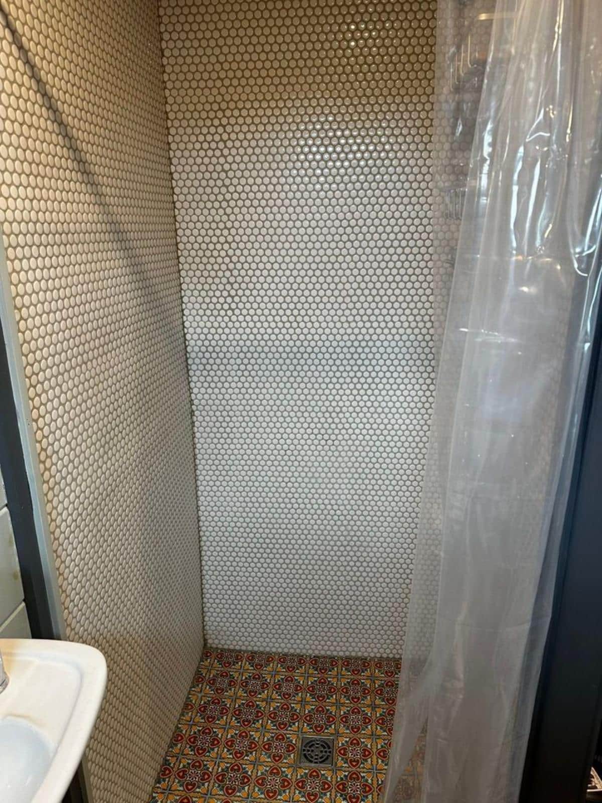 full length shower area in bathroom of super tiny home